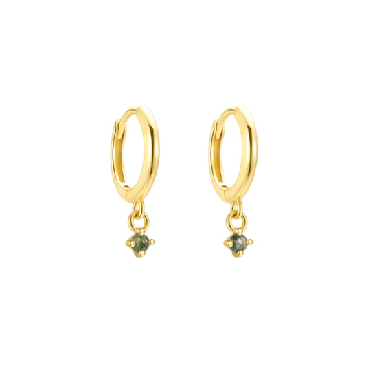 Gold hoop earrings with green gemstones on a white background